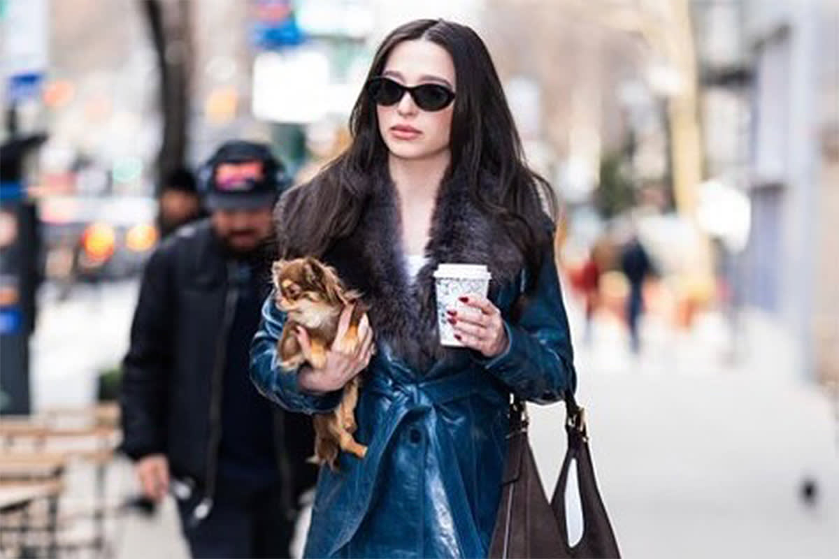 Mikey Madison with her small dog