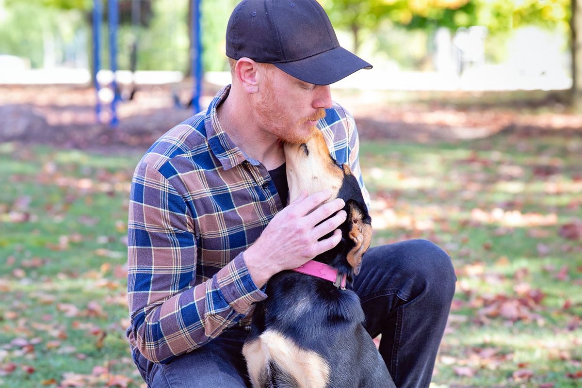 person in a hat with a dog