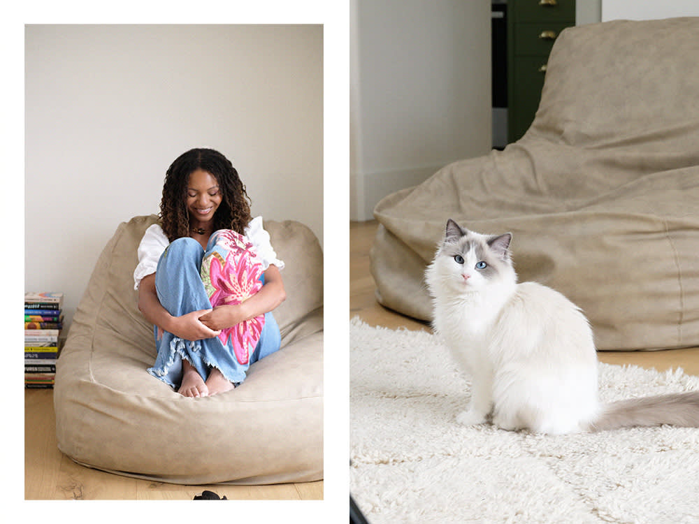 Leah Thomas on a chair; Leah Thomas's white cat