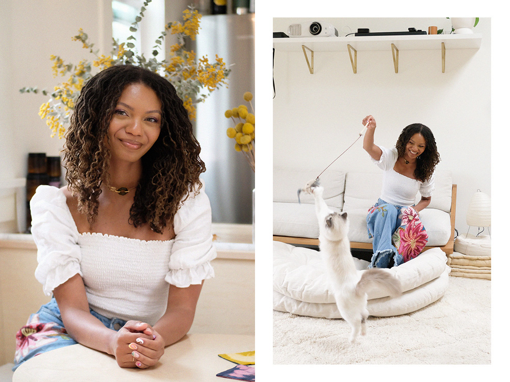 Leah Thomas; Leah Thomas playing with her white cat