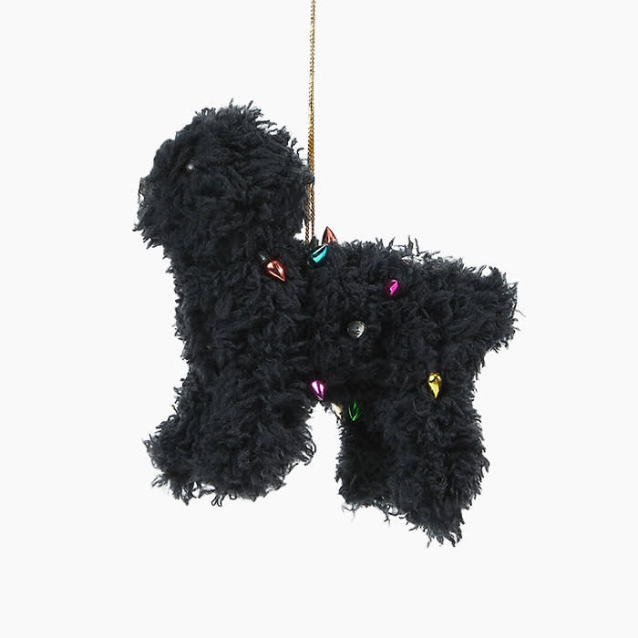 black poodle ornament with christmas lights in its fur