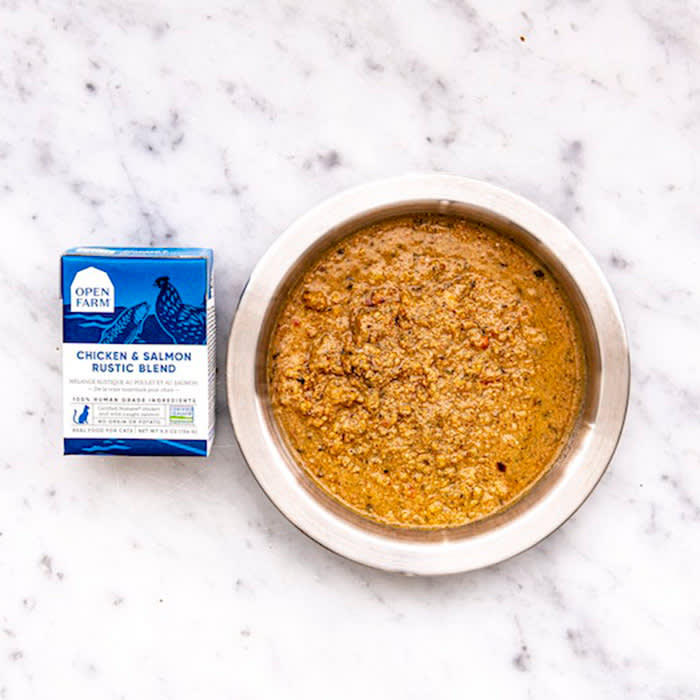 open farm meal in a bowl next to blue packaging