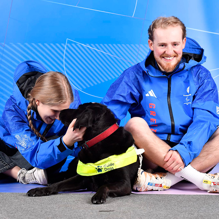Hester Poole snuggles her service dog, Pickle