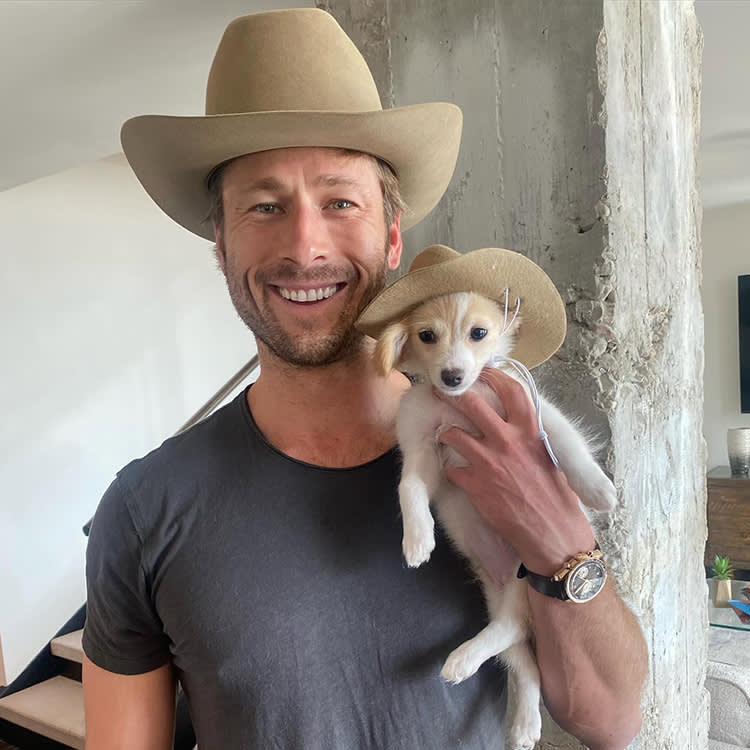 Glen Powell and his dog Brisket wearing Stetson hats