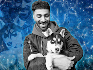 A person with a dog in front of a starry backdrop