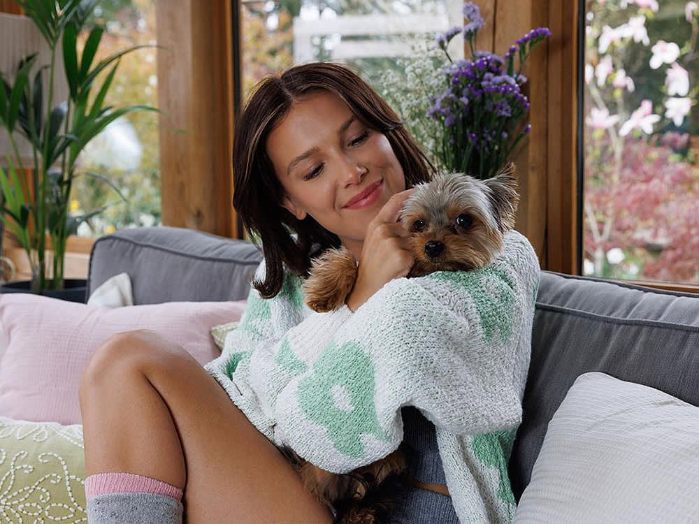 Millie Bobby Brown snuggles with dog