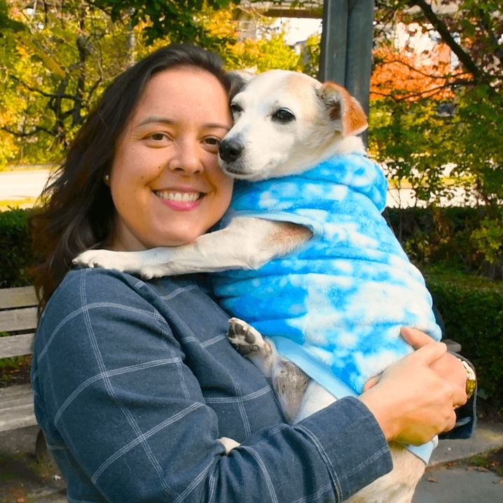 Dr. Barbara, holding her dog
