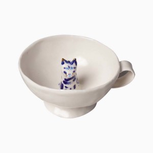 the ceramic teacup with a cat inside