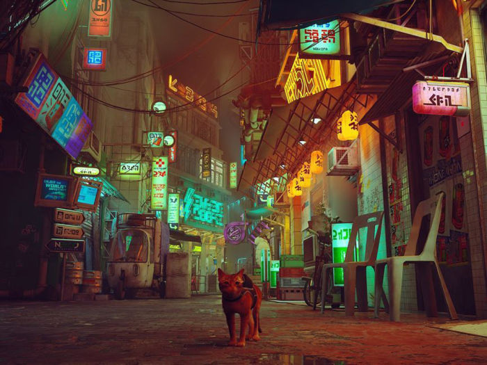 Still image from a stray cat video game showing a stray cat on the ground in a clustered and dimly lit city street filled with wires and neon lights