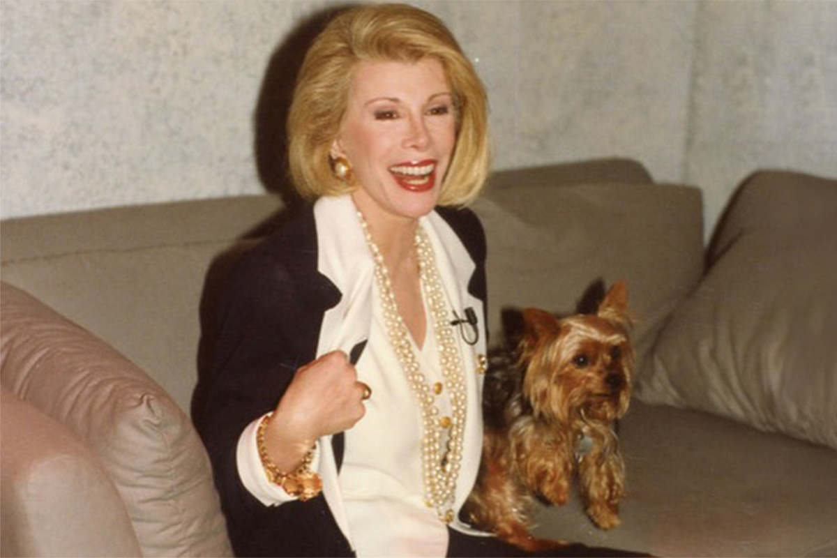 Joan Rivers with a dog
