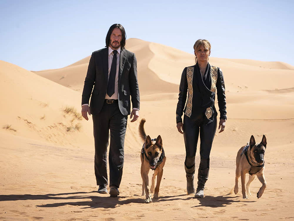 Keanu Reeves and Halle Berry star in John Wick with two German Shepherd dogs.