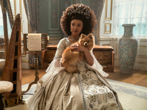 Queen Charlotte (India Amarteifi) and her dog in the Netflix series Queen Charlotte.