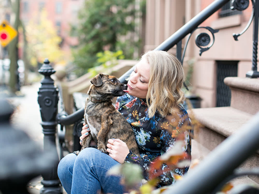 Sophie Gamand and her small brown dog