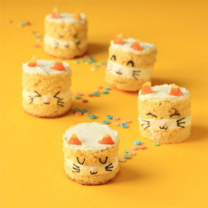 small cakes with cat whisker and cat ear decorations