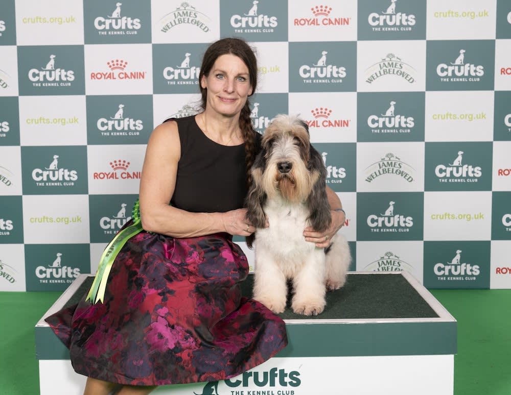 woman cuddling her dog at crufts