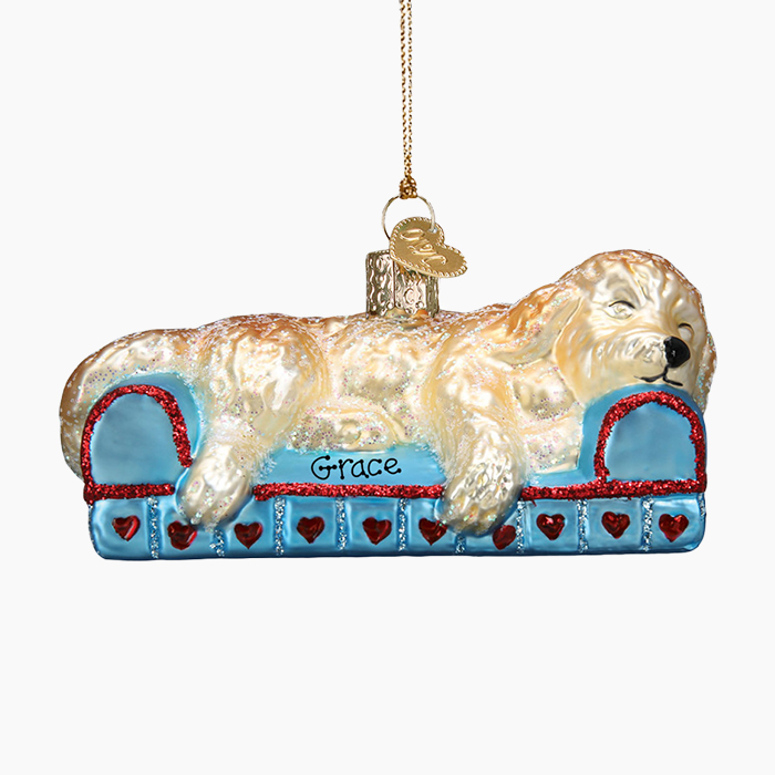 sleepy dog on blue bed ornament