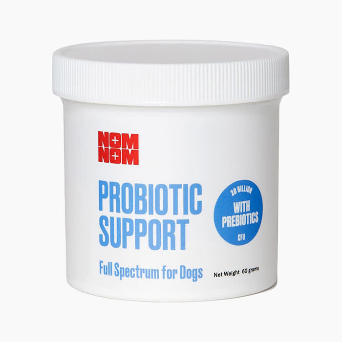 nom nom probiotics in white tub with red and blue lettering