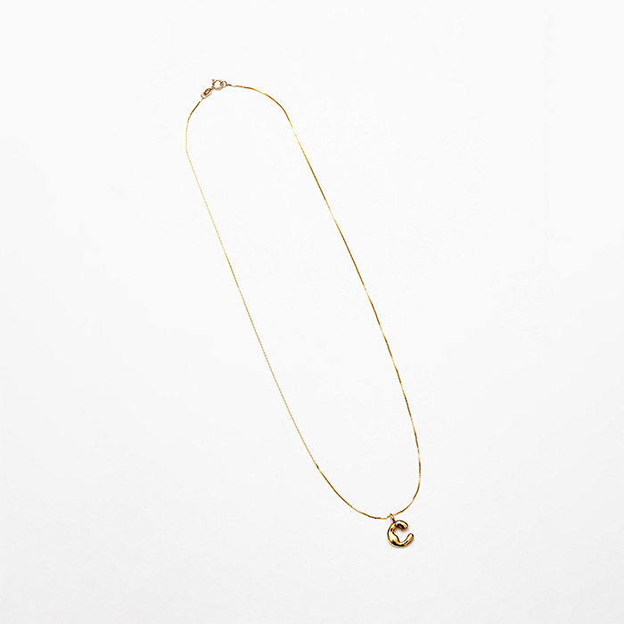 yellow gold necklace with puffy "C" charm