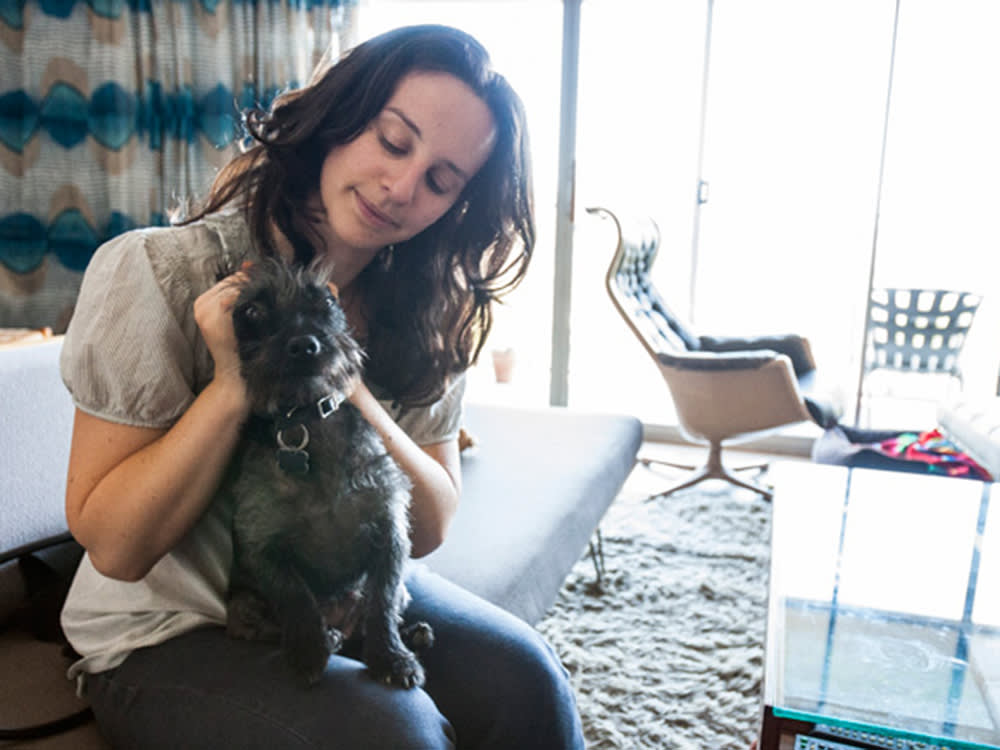 Jessica Koslow and her small black dog, Munk