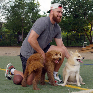 Travis Kelce with two dogs
