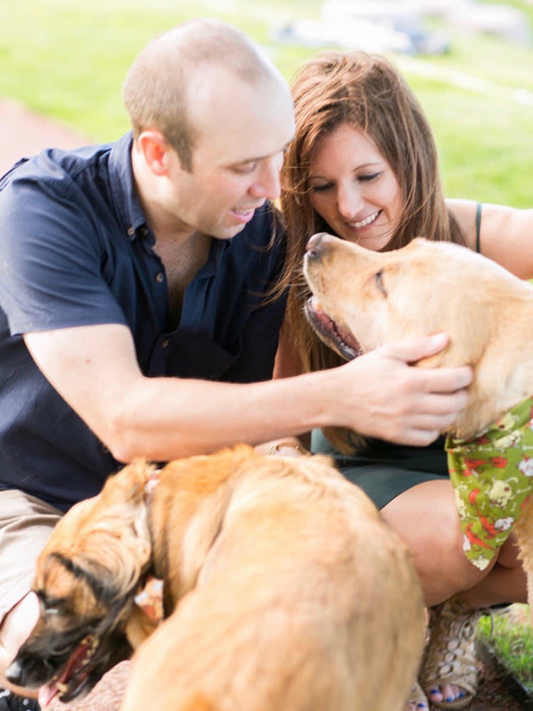 Jamie and Tom Qiunn and their golden-brown dogs, Benny and Dublin