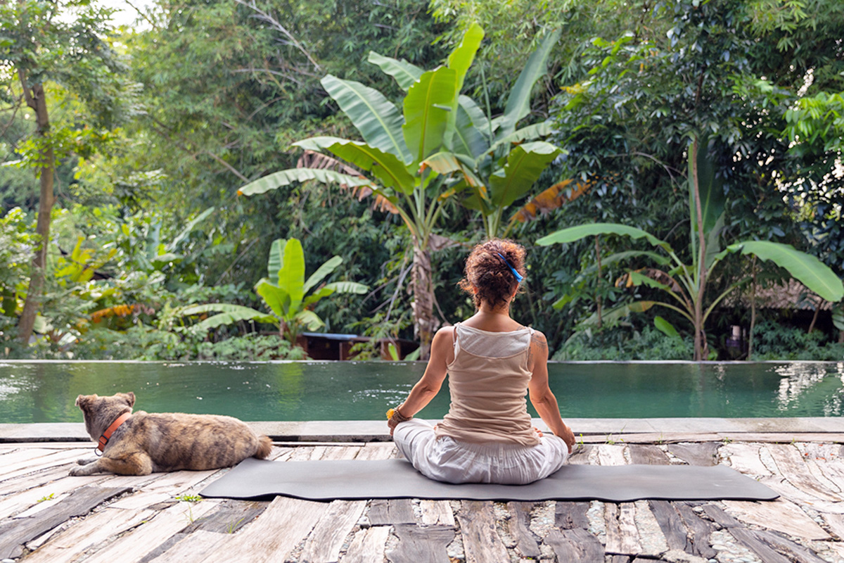 person doing breathwork with their dog