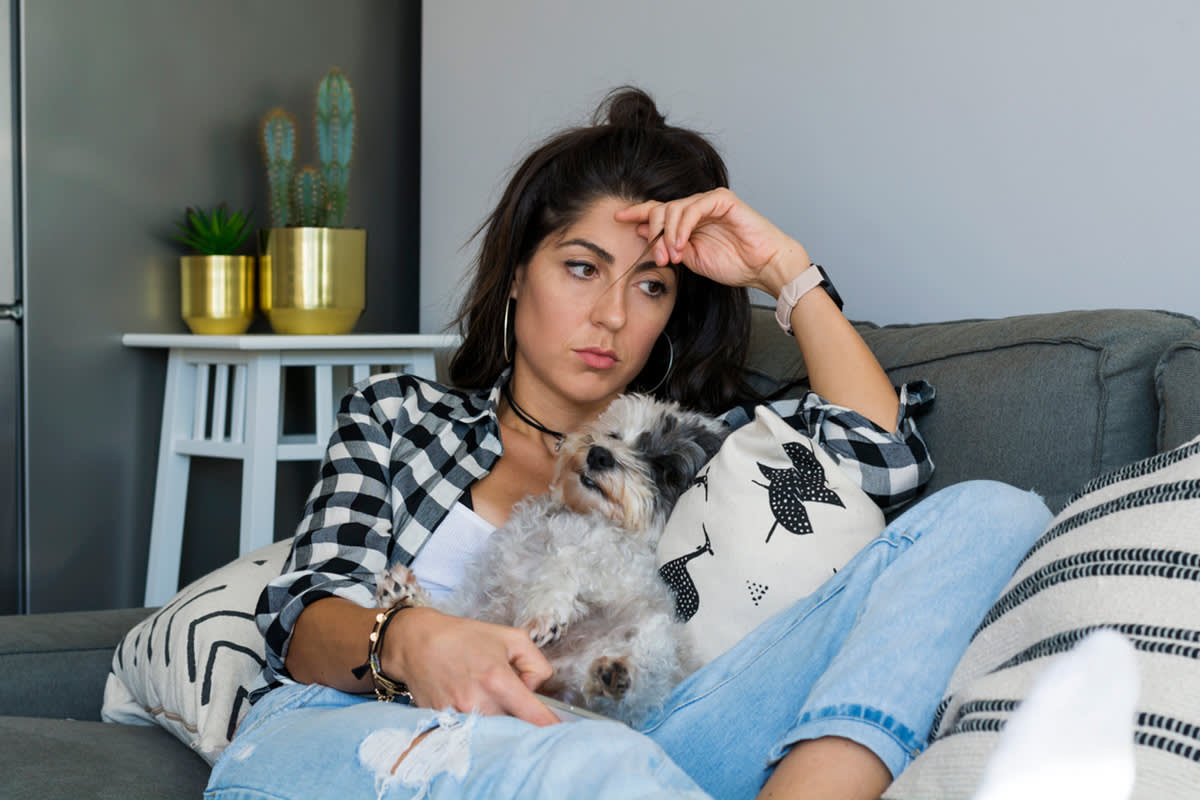 stressed pet parent with dog
