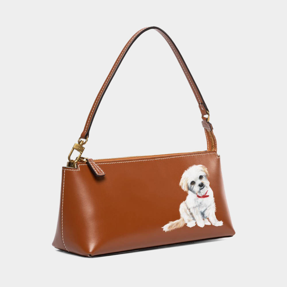 brown leather handbag with white dog painted on front