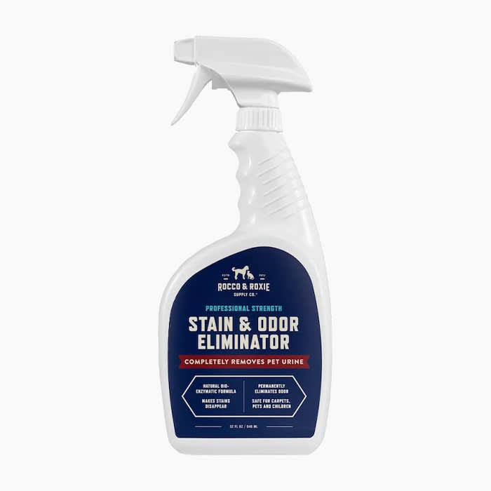 stain and odor remover spay in white bottle and navy blue label