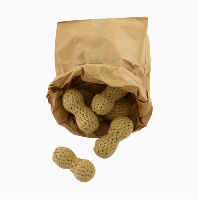 catnip stuffed crochet peanut toys in a paper bag