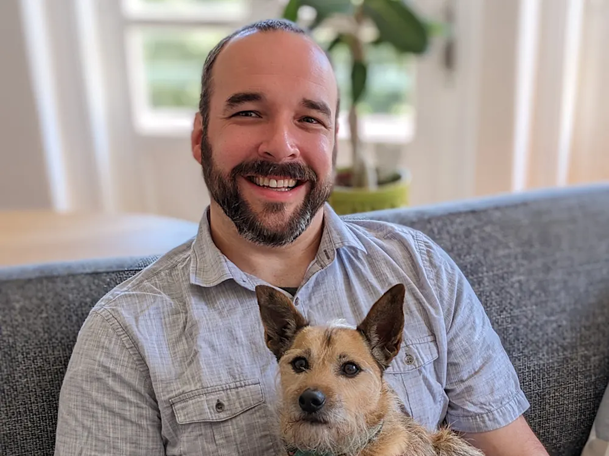 Dr. Bartley Harrison holding his dog