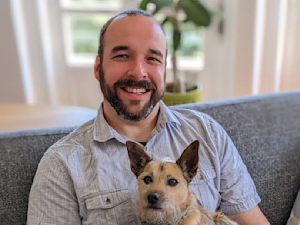 Dr. Bartley Harrison holding his dog
