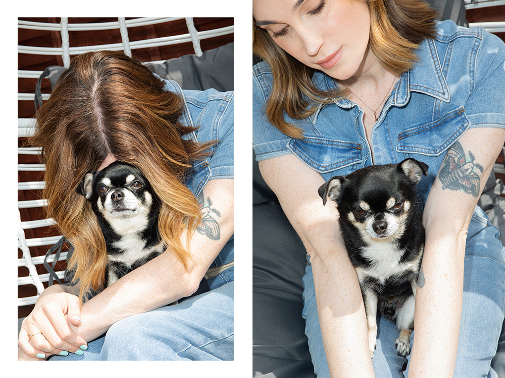 Juno Dawson outdoors on a chair with her dog 