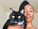 Sydnee Washington holding cat