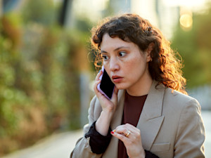 concerned person talking on phone