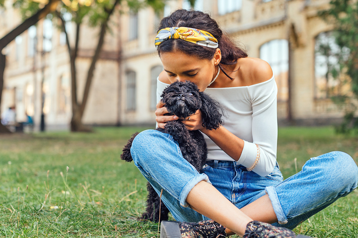 person kissing dog