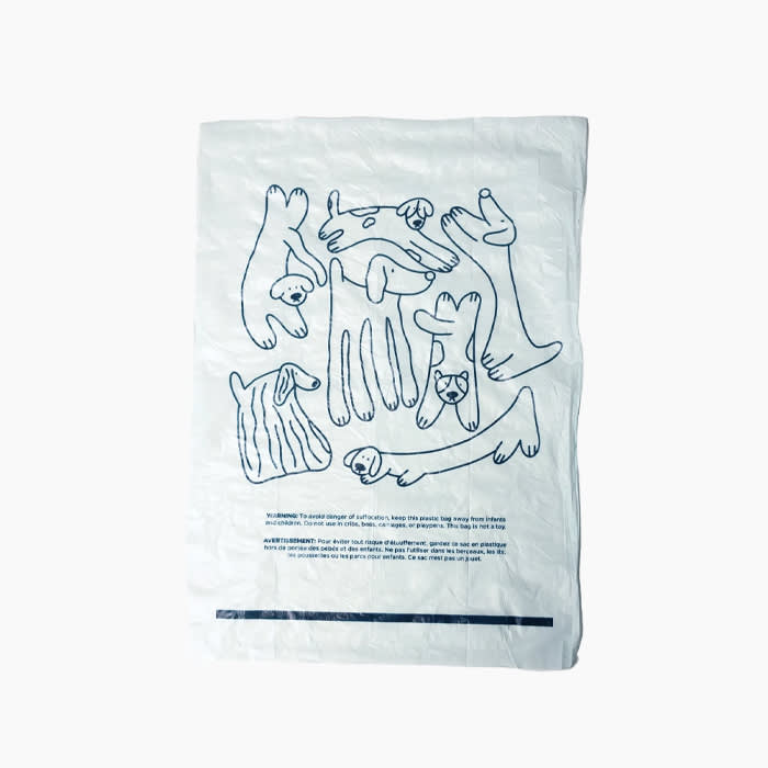 dog waste bags in white with navy thinline dog motif