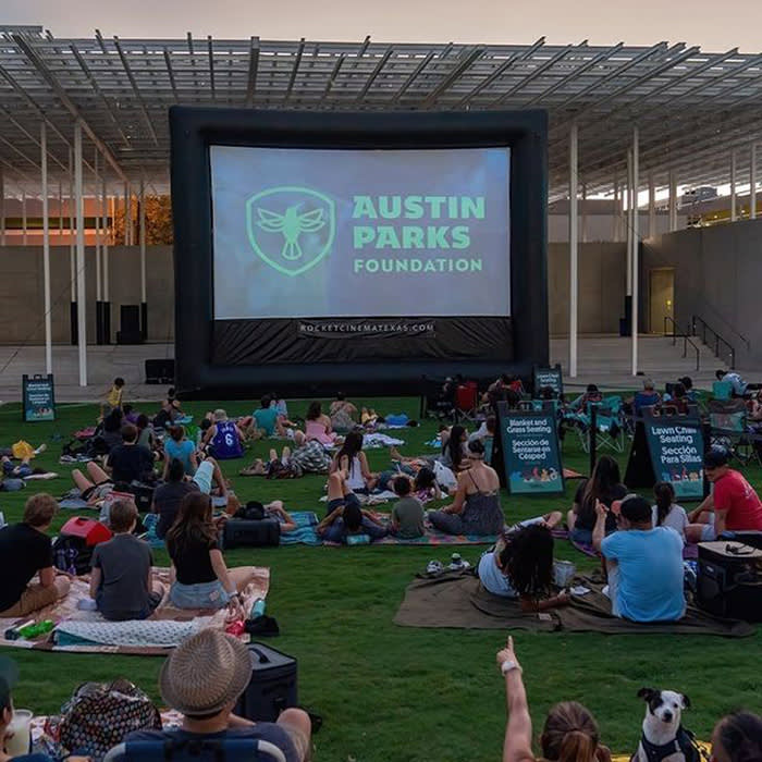movie screen displayed on grassy field
