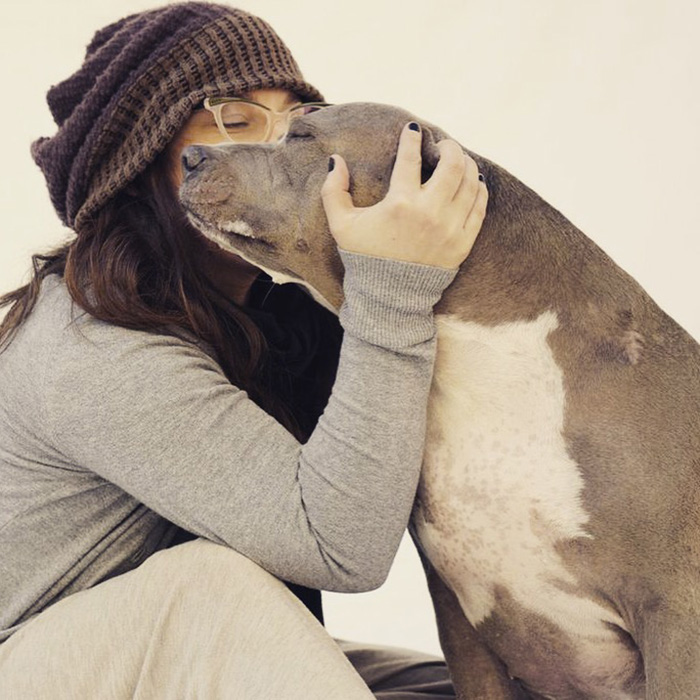 Corry kissing dog outside