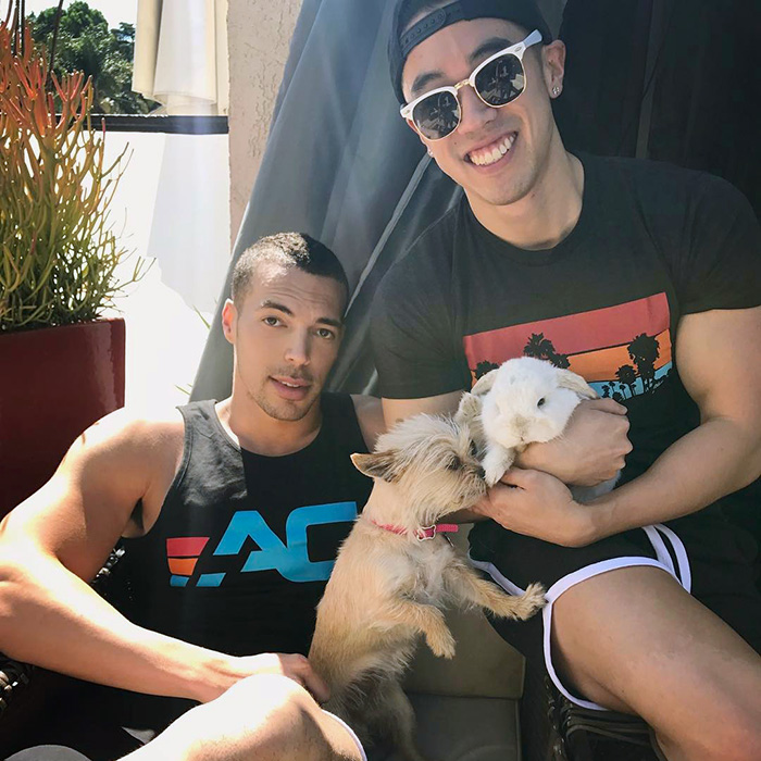 a dog and a bunny pose at The Abbey with their dads