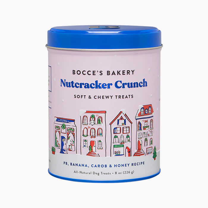 the tin of dog treats with a blue lid