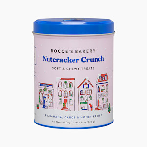 the tin of dog treats with a blue lid