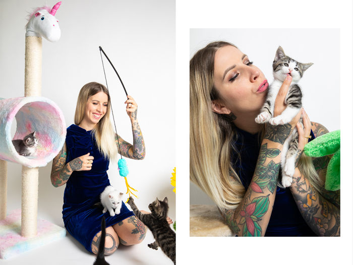 Hannah Shaw plays with three cats