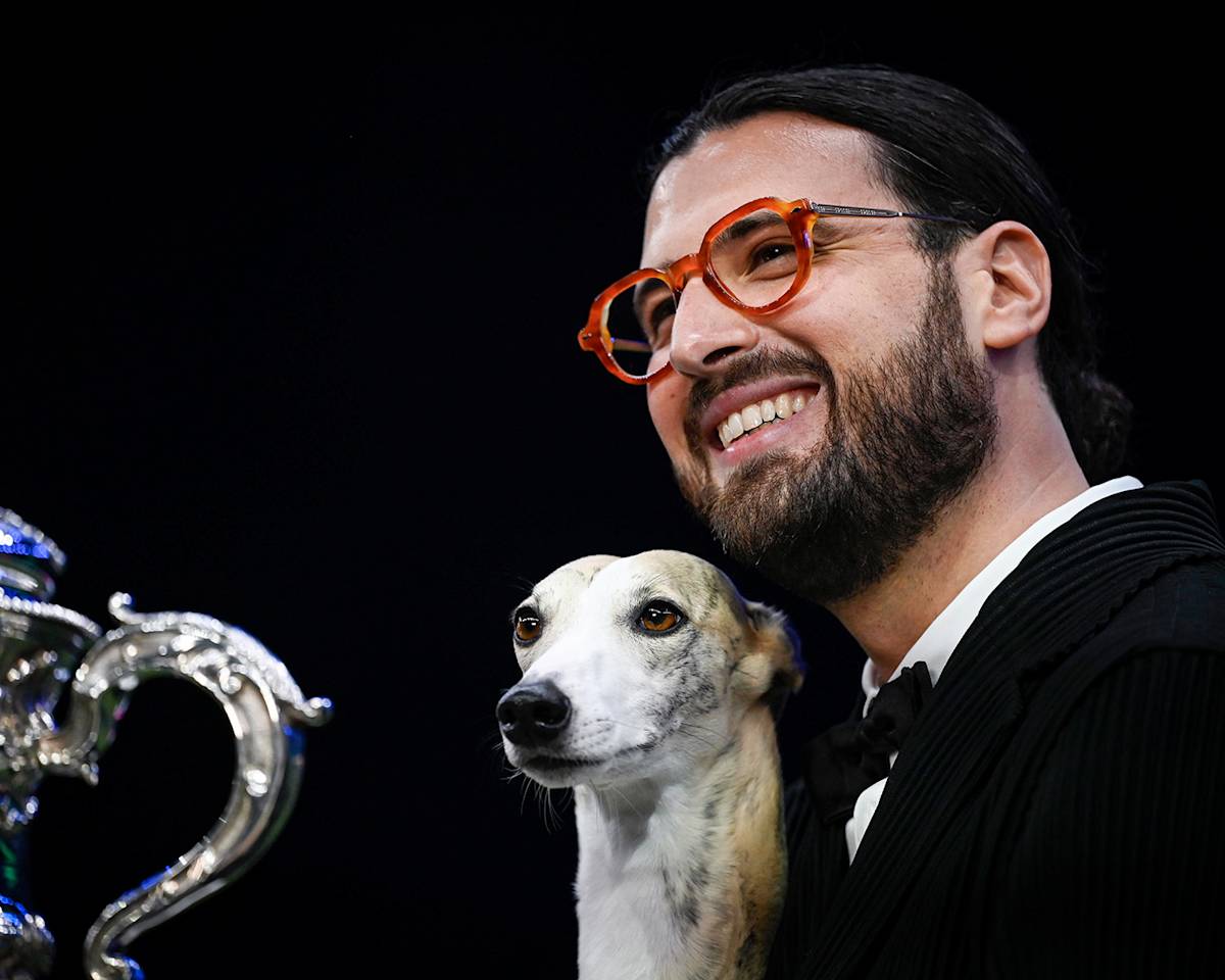 Giovanni Liguori, from Italy, with Miuccia, a Whippet, who won the coveted title of Best in Show at Crufts 2025.