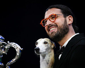 Giovanni Liguori, from Italy, with Miuccia, a Whippet, who won the coveted title of Best in Show at Crufts 2025.