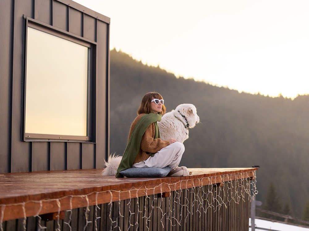 Woman and dog looking at solar eclipse