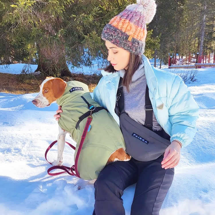 Woman with dog in Paikka coat.