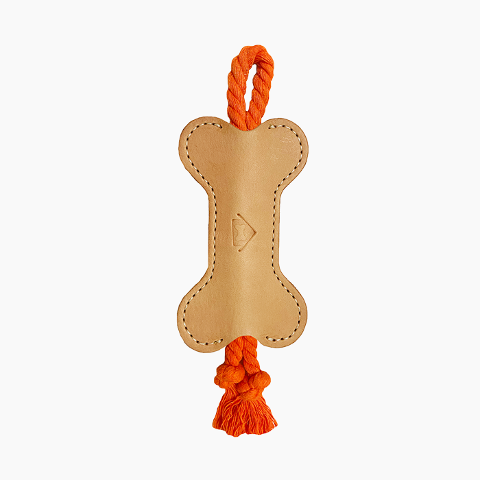 red rope toy with brown leather bone