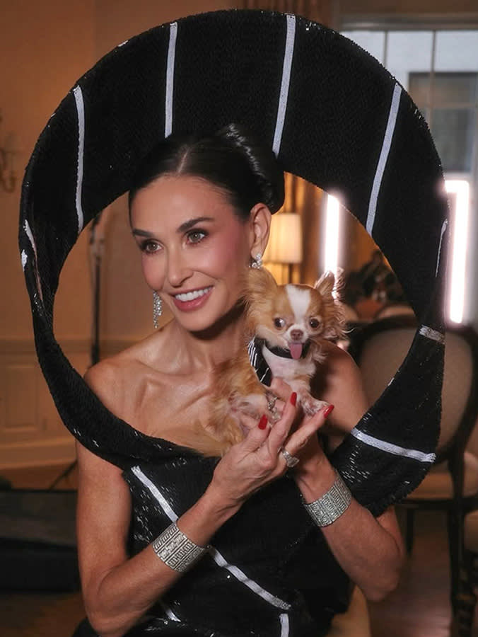 Demi Moore and her dog getting ready for an event.