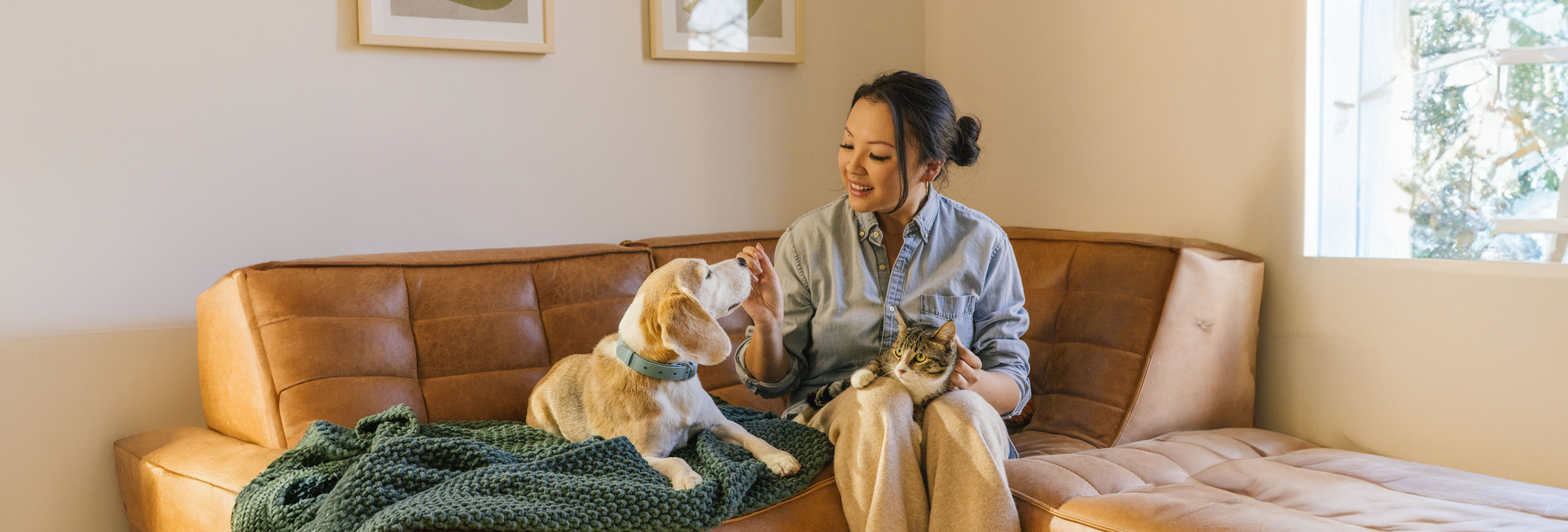 Woman with cat and dog